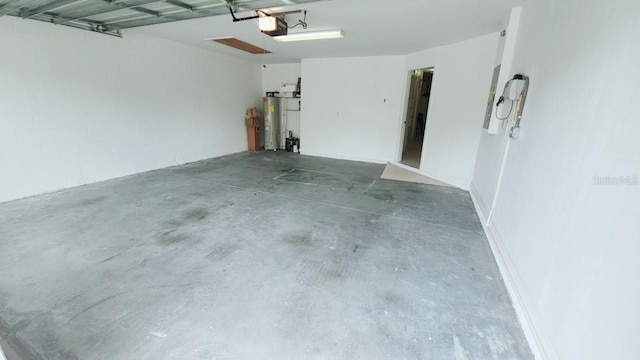 garage featuring water heater and a garage door opener