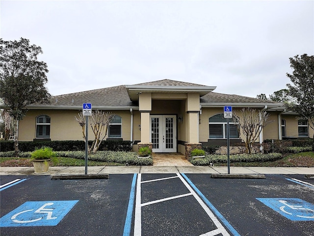 view of property featuring uncovered parking