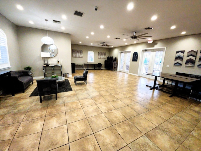 interior space with light tile patterned flooring, visible vents, and recessed lighting