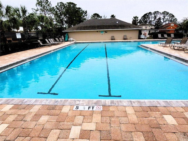 community pool with fence