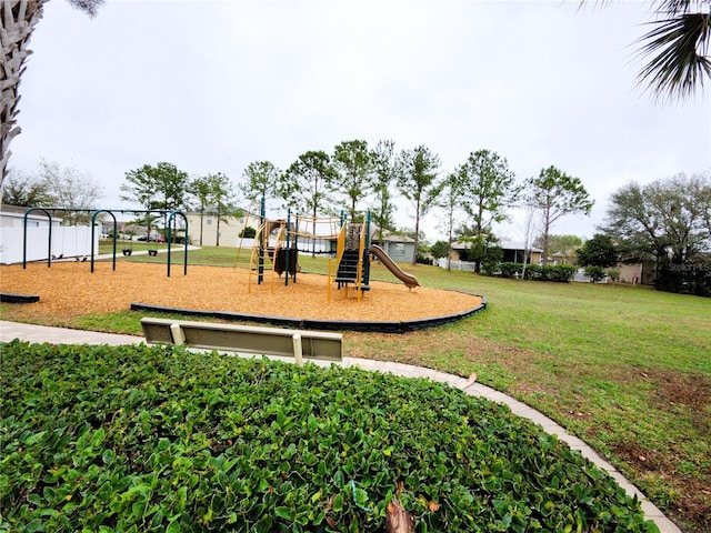 community jungle gym with a yard