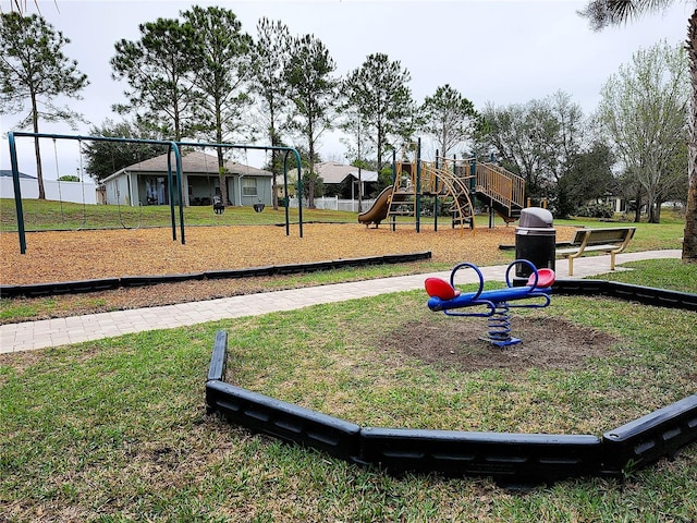 community play area featuring a lawn