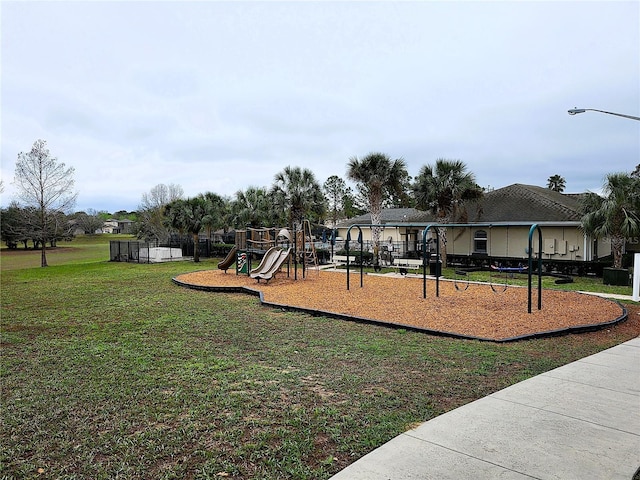 community play area with a lawn