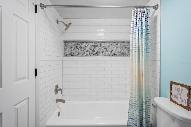 bathroom featuring shower / bath combination with curtain and toilet