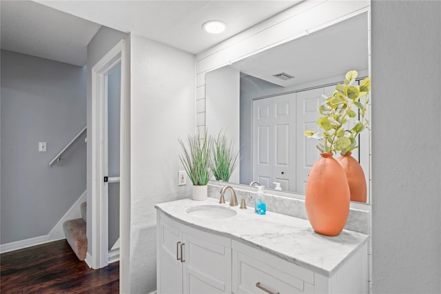 bathroom with vanity and hardwood / wood-style flooring