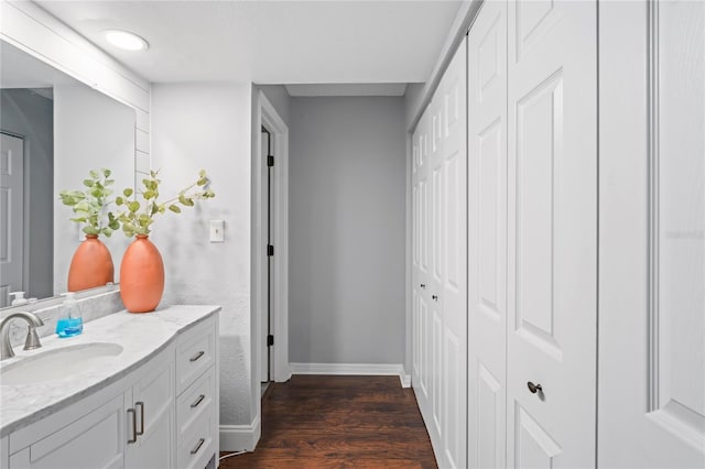 bathroom featuring wood-type flooring and vanity