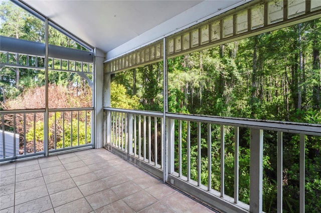 unfurnished sunroom with vaulted ceiling