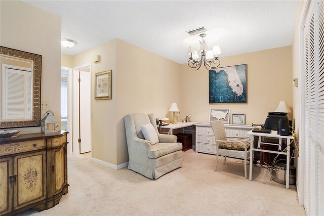 carpeted home office with a notable chandelier