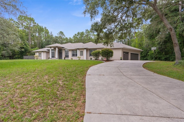 ranch-style house featuring a garage and a front yard