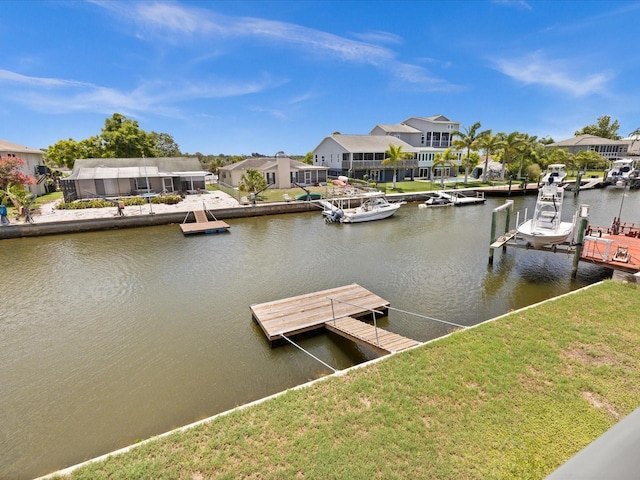 view of dock featuring a yard and a water view