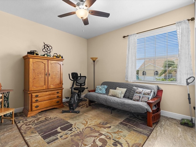 sitting room featuring ceiling fan