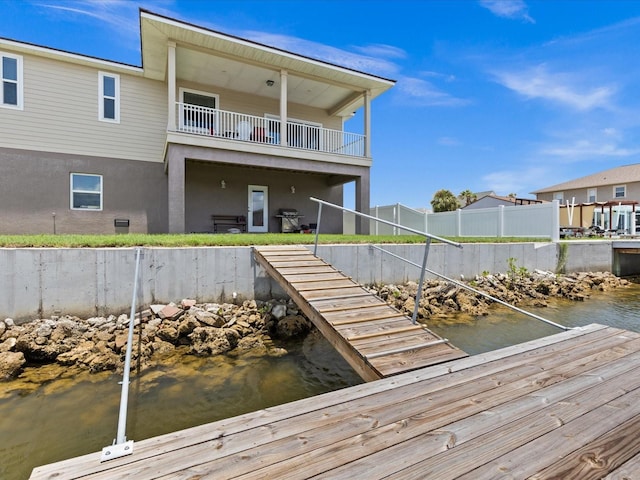 dock area with a water view