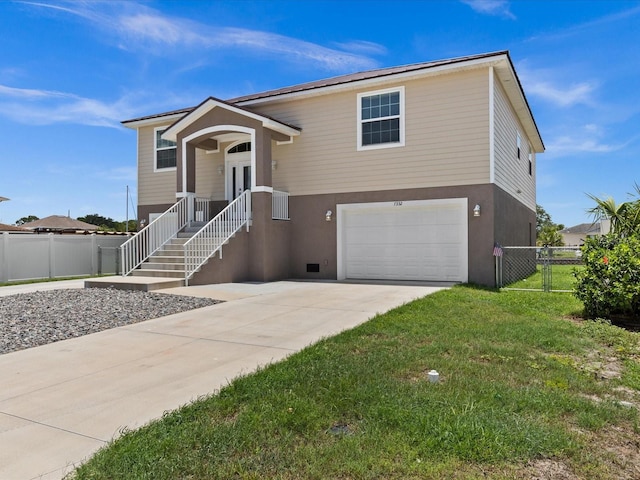 view of front facade with a garage and a front lawn