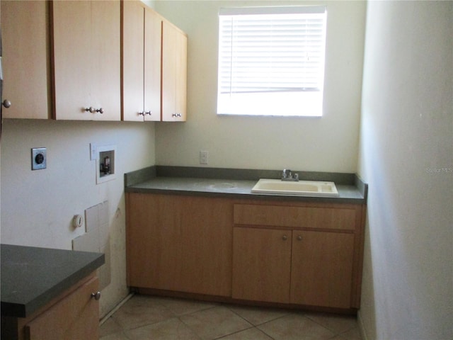 washroom featuring sink, cabinets, washer hookup, light tile patterned floors, and hookup for an electric dryer