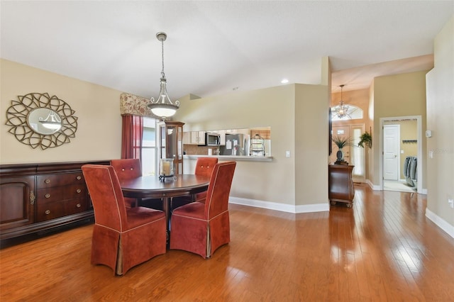 dining space featuring wood-type flooring