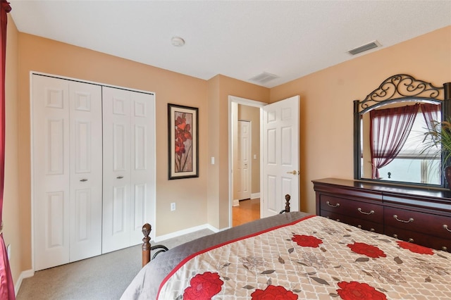 carpeted bedroom with a closet