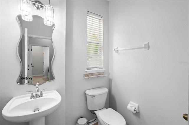 bathroom with toilet and sink