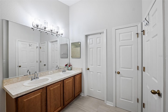 bathroom with tile patterned floors and vanity