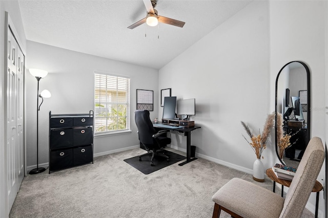 home office with light carpet, ceiling fan, and lofted ceiling