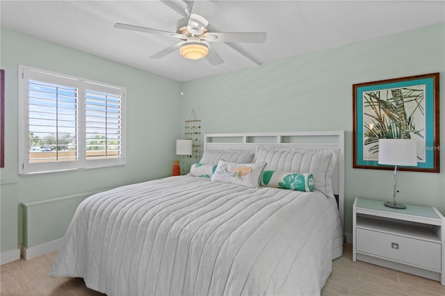 bedroom featuring ceiling fan and light wood-type flooring