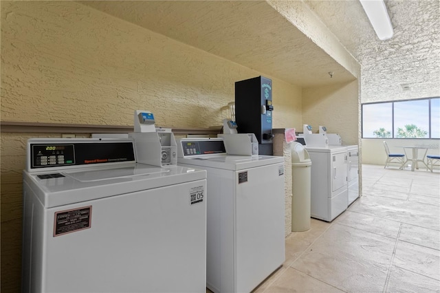 laundry room featuring washing machine and clothes dryer