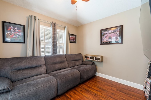 living room featuring dark hardwood / wood-style floors and ceiling fan