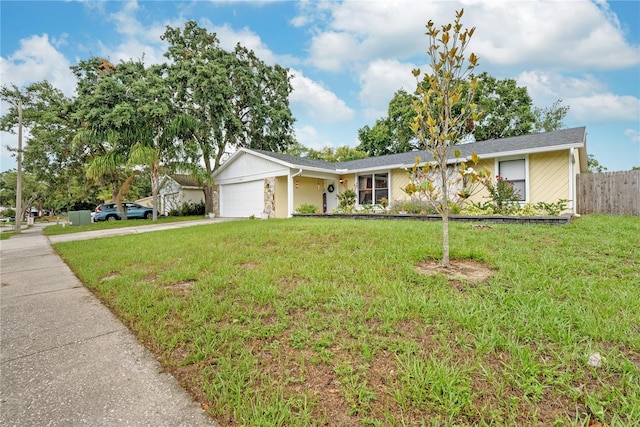 single story home with a front lawn and a garage