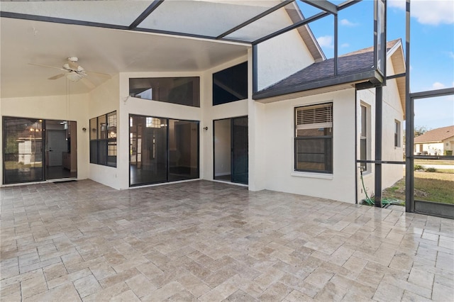 exterior space with ceiling fan and a lanai