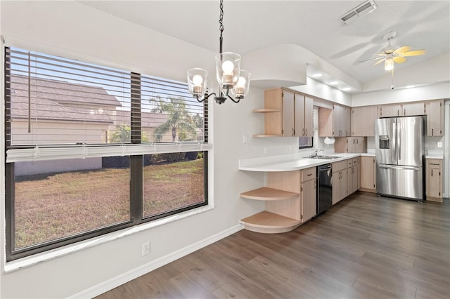 kitchen featuring appliances with stainless steel finishes, lofted ceiling, sink, hanging light fixtures, and light brown cabinets