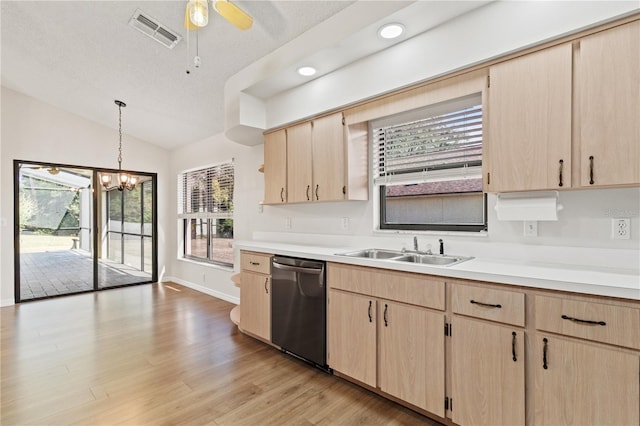 kitchen with pendant lighting, stainless steel dishwasher, sink, and light brown cabinets