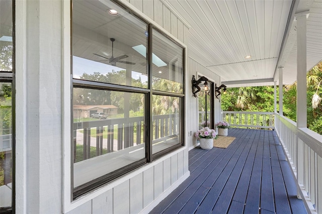 deck featuring ceiling fan and a porch