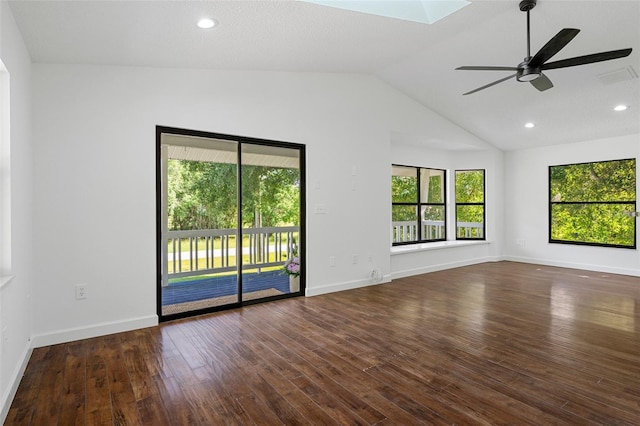 unfurnished room with ceiling fan, lofted ceiling, and dark wood-type flooring