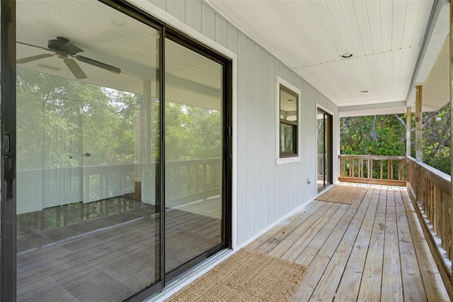 wooden deck featuring ceiling fan and covered porch