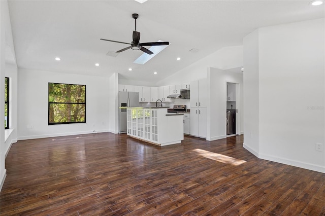 unfurnished living room with dark hardwood / wood-style flooring, high vaulted ceiling, ceiling fan, and sink