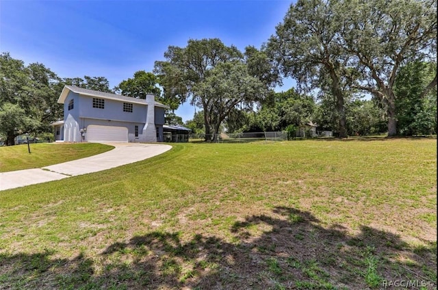 view of yard with a garage