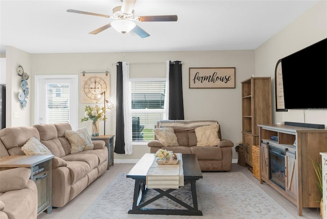 living room with light tile patterned floors and ceiling fan