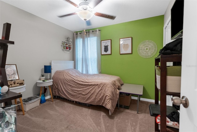 carpeted bedroom featuring ceiling fan