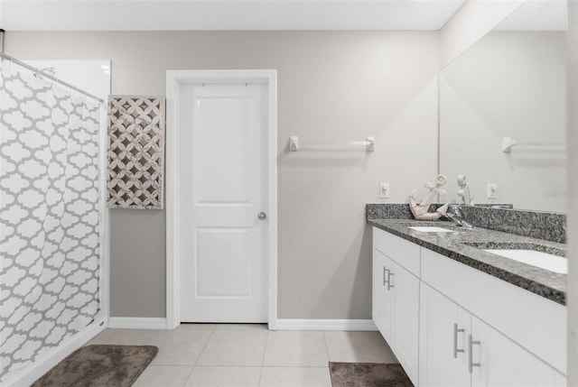 bathroom with walk in shower, tile patterned floors, and vanity