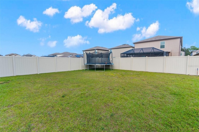 view of yard with a trampoline