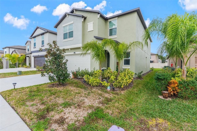 view of front of property with a garage and a front lawn