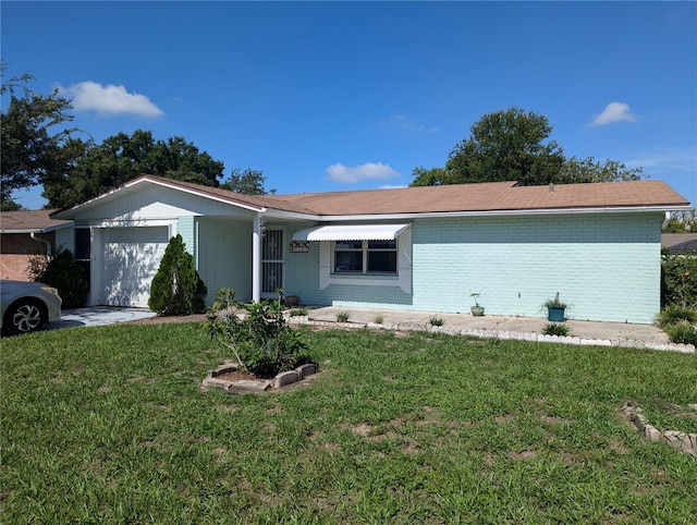 ranch-style house with a garage and a front yard