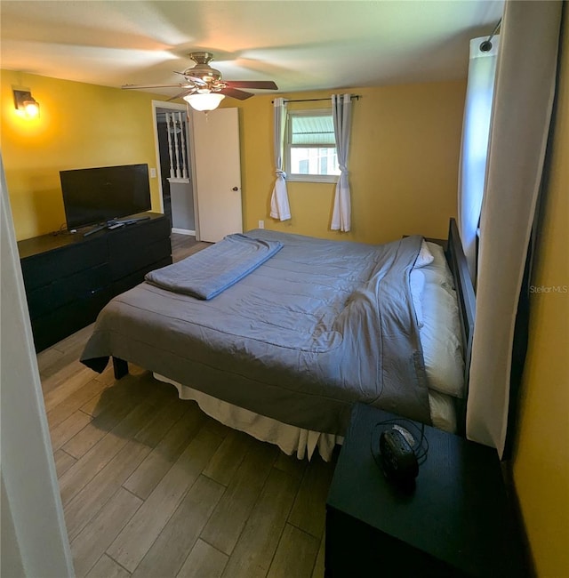 bedroom featuring ceiling fan and hardwood / wood-style floors