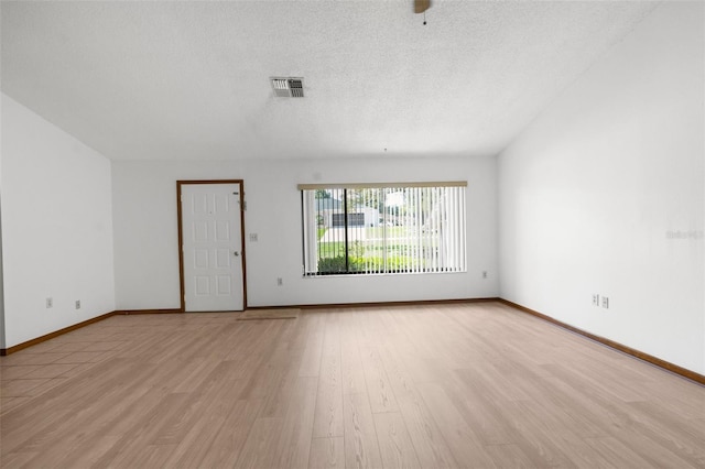 spare room with light hardwood / wood-style flooring