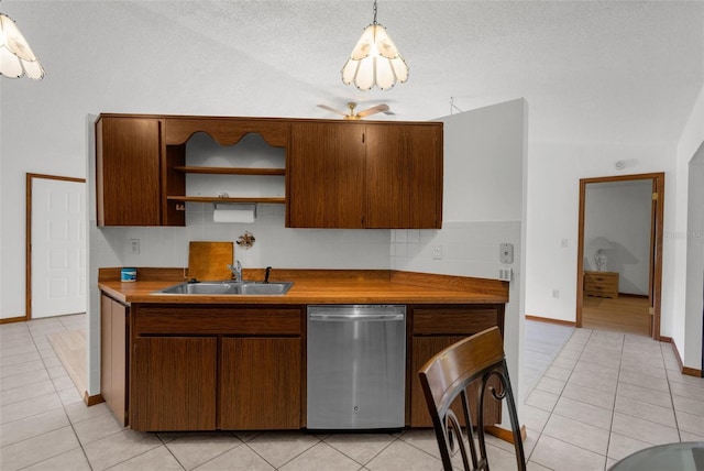 kitchen featuring dishwasher, sink, hanging light fixtures, ceiling fan, and light tile patterned flooring