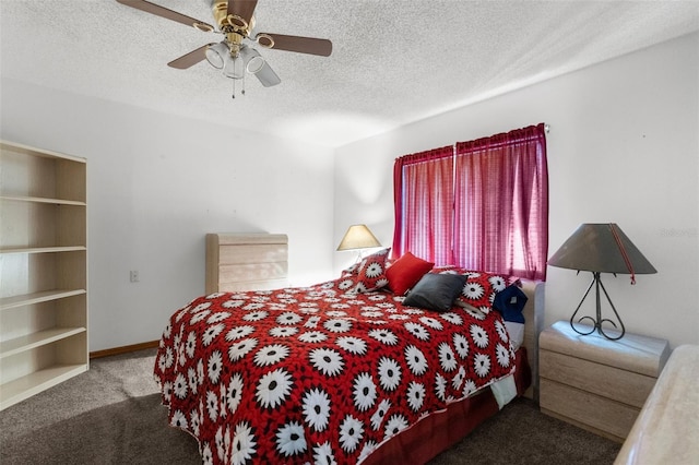 bedroom with ceiling fan, carpet floors, and a textured ceiling