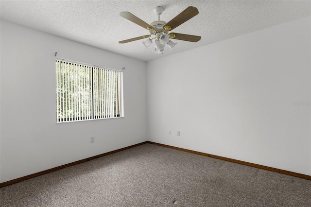 unfurnished room featuring ceiling fan, carpet floors, and a textured ceiling