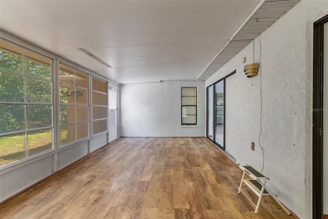 unfurnished sunroom featuring a healthy amount of sunlight