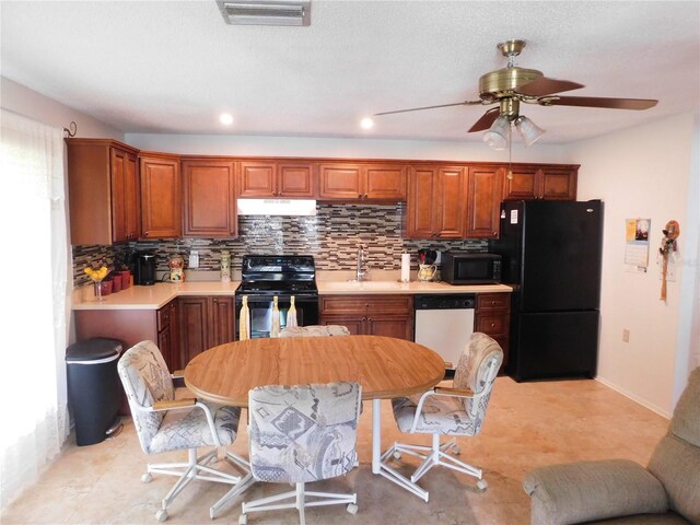 kitchen with backsplash, black appliances, ceiling fan, and light tile flooring