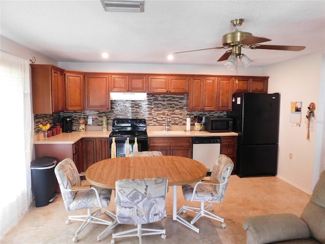 kitchen featuring sink, backsplash, black appliances, and ceiling fan