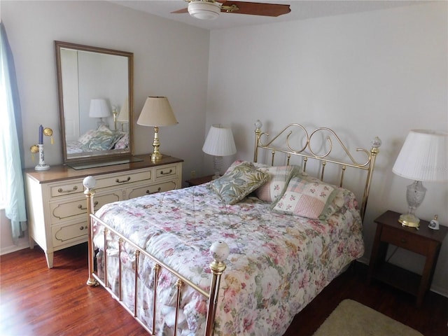 bedroom featuring ceiling fan and dark hardwood / wood-style flooring